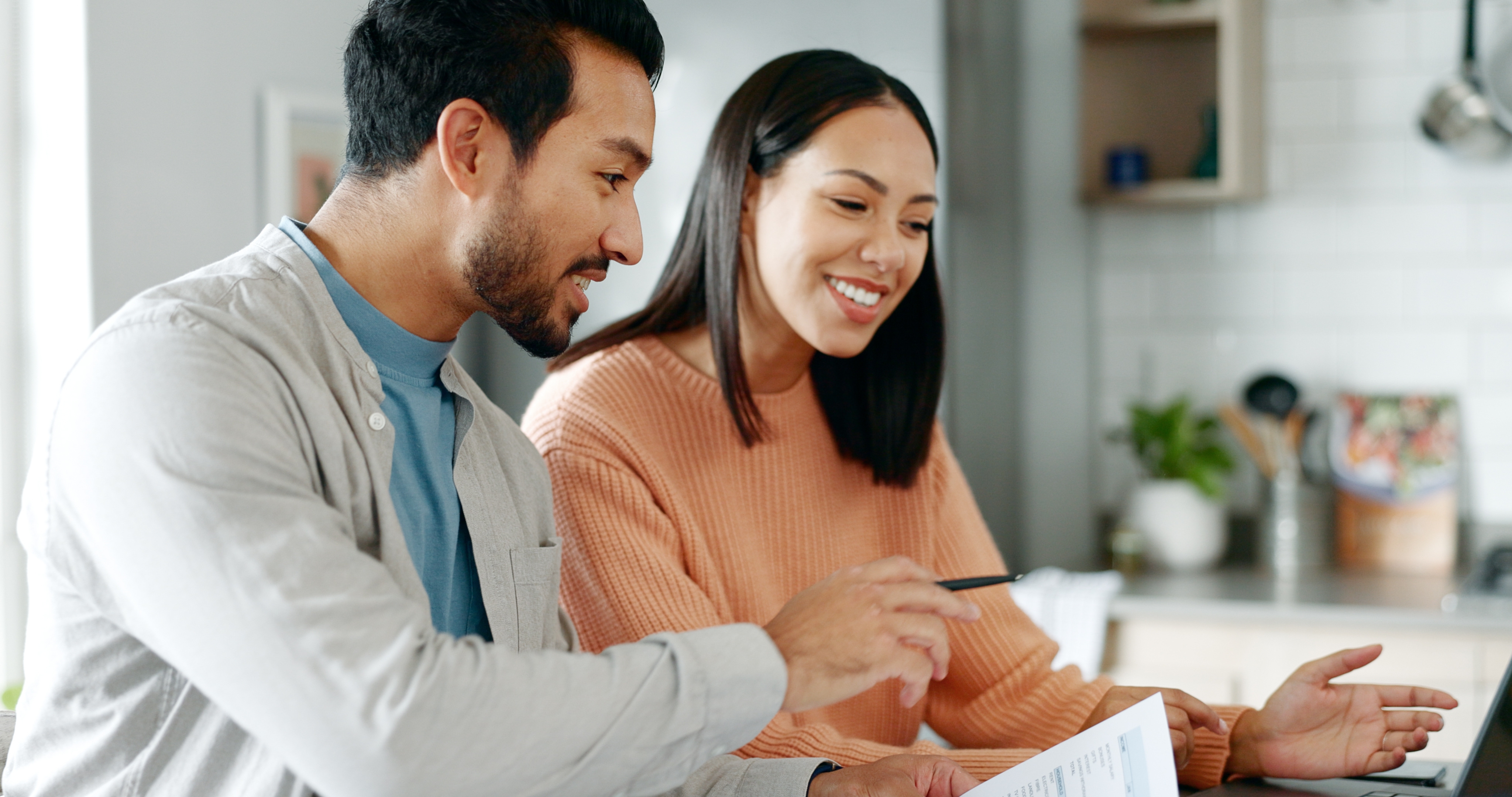 Couple looking at their financial goals for 2025